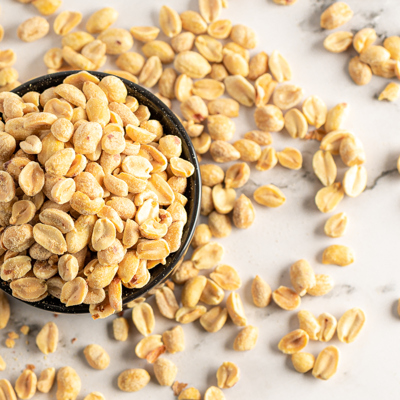 Peanuts spilling out of bowl