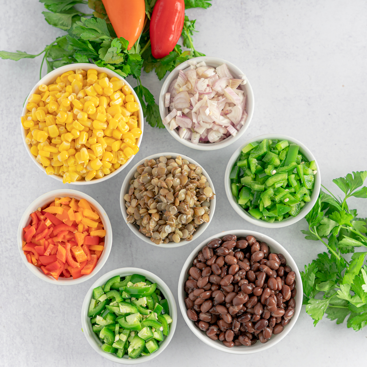 Ingredients top down in cowboy caviar recipe. Many different varieties of colors
