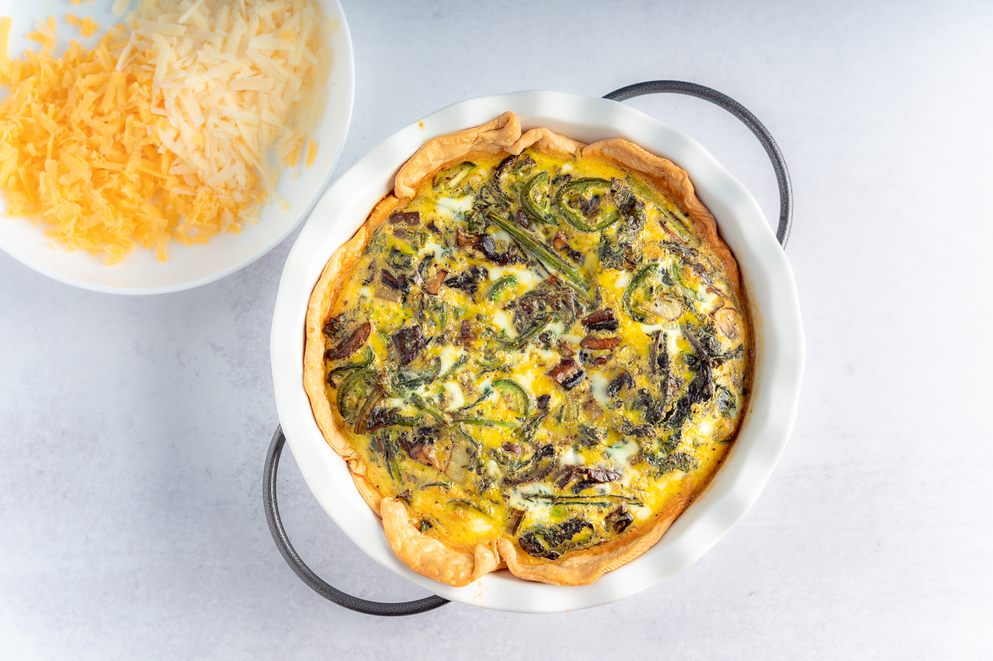 Kale and Mushroom Quiche in a pie dish. 