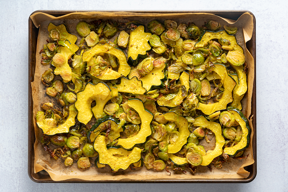 Roasted brussels and acorn squash on sheet pan