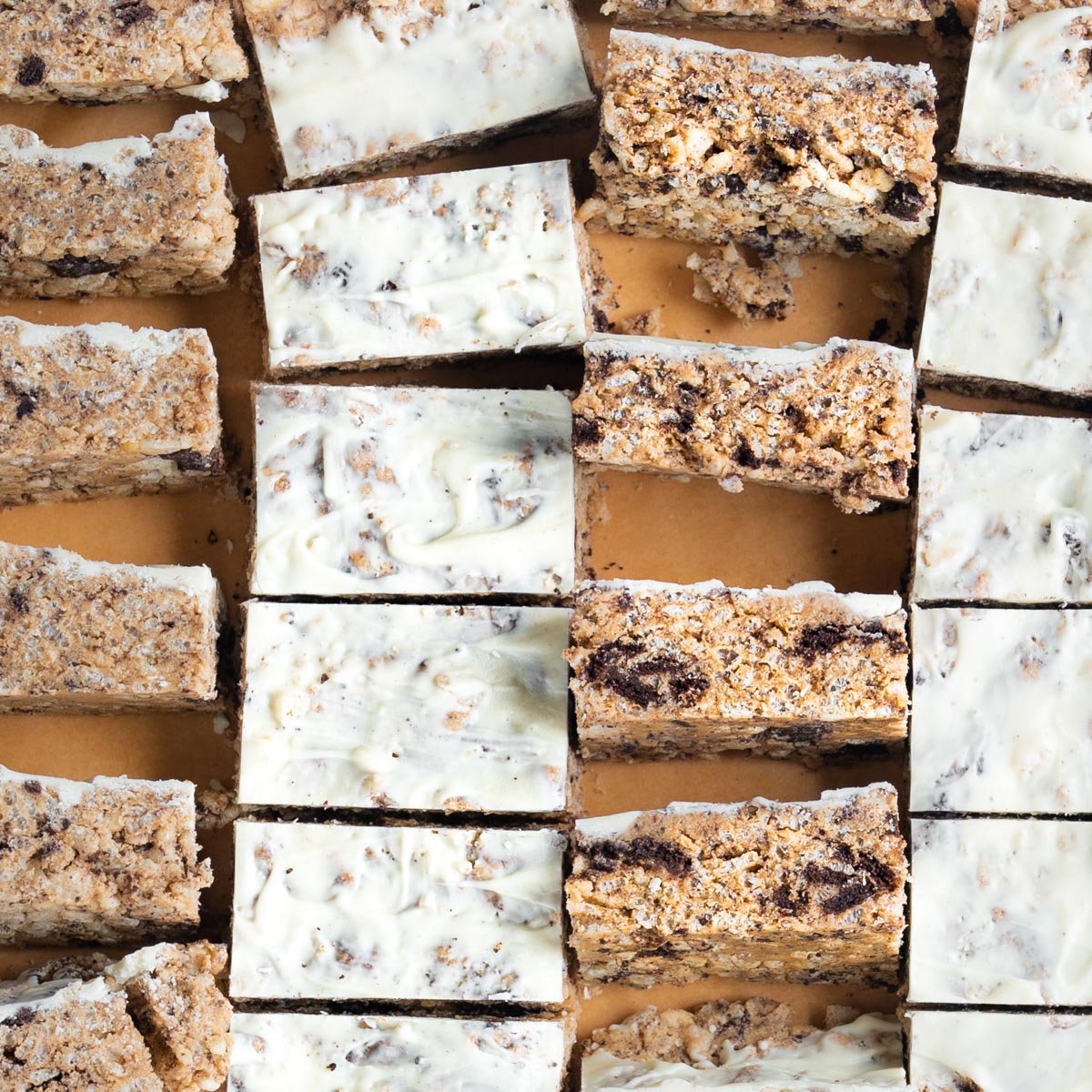 An array of cookies and cream protein bars with a white chocolate frosting
