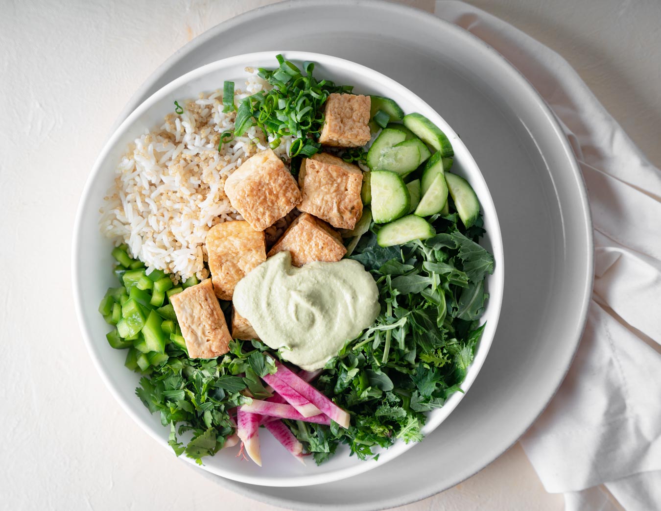 Image of Greens and Ancient Grains bowl topped with crispy baked tofu