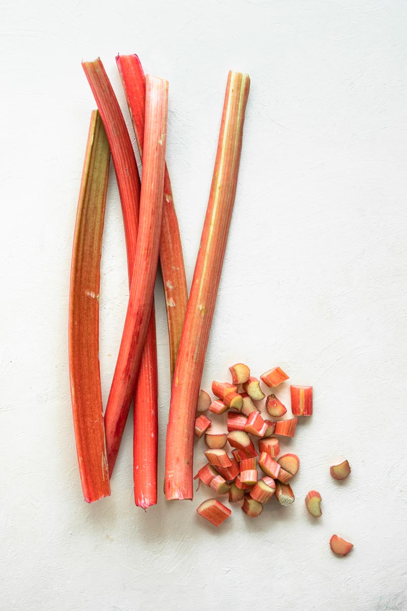 Rhubarb on a white background some stalks some cut up