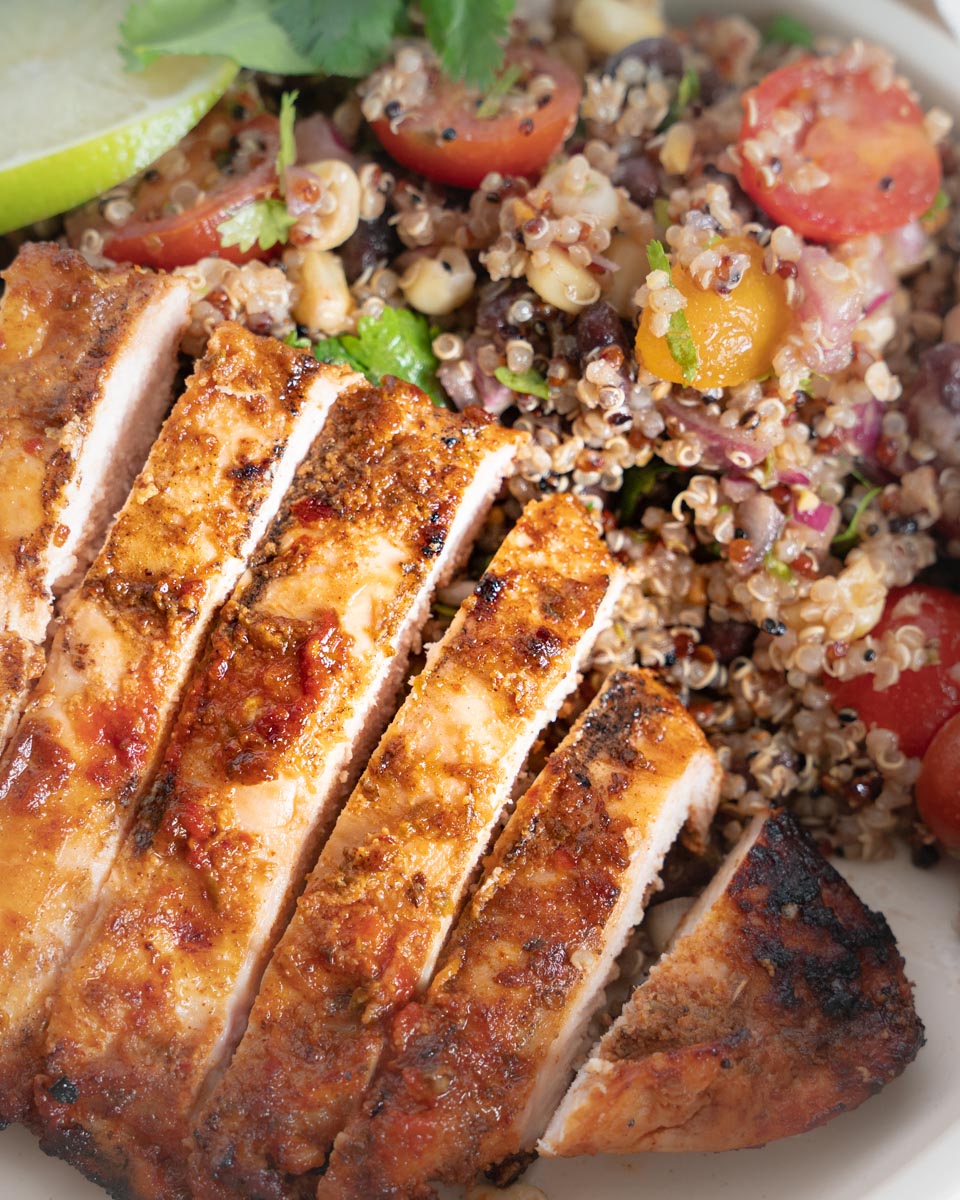 Closeup of Marinated Southwest Chicken and Southwest Bowls
