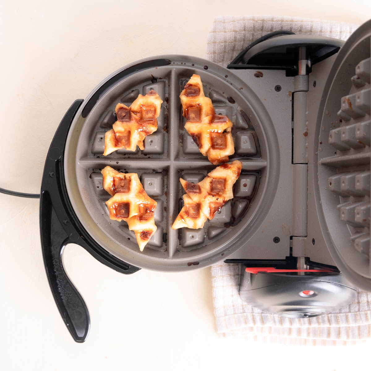 Croffles in a waffle iron.