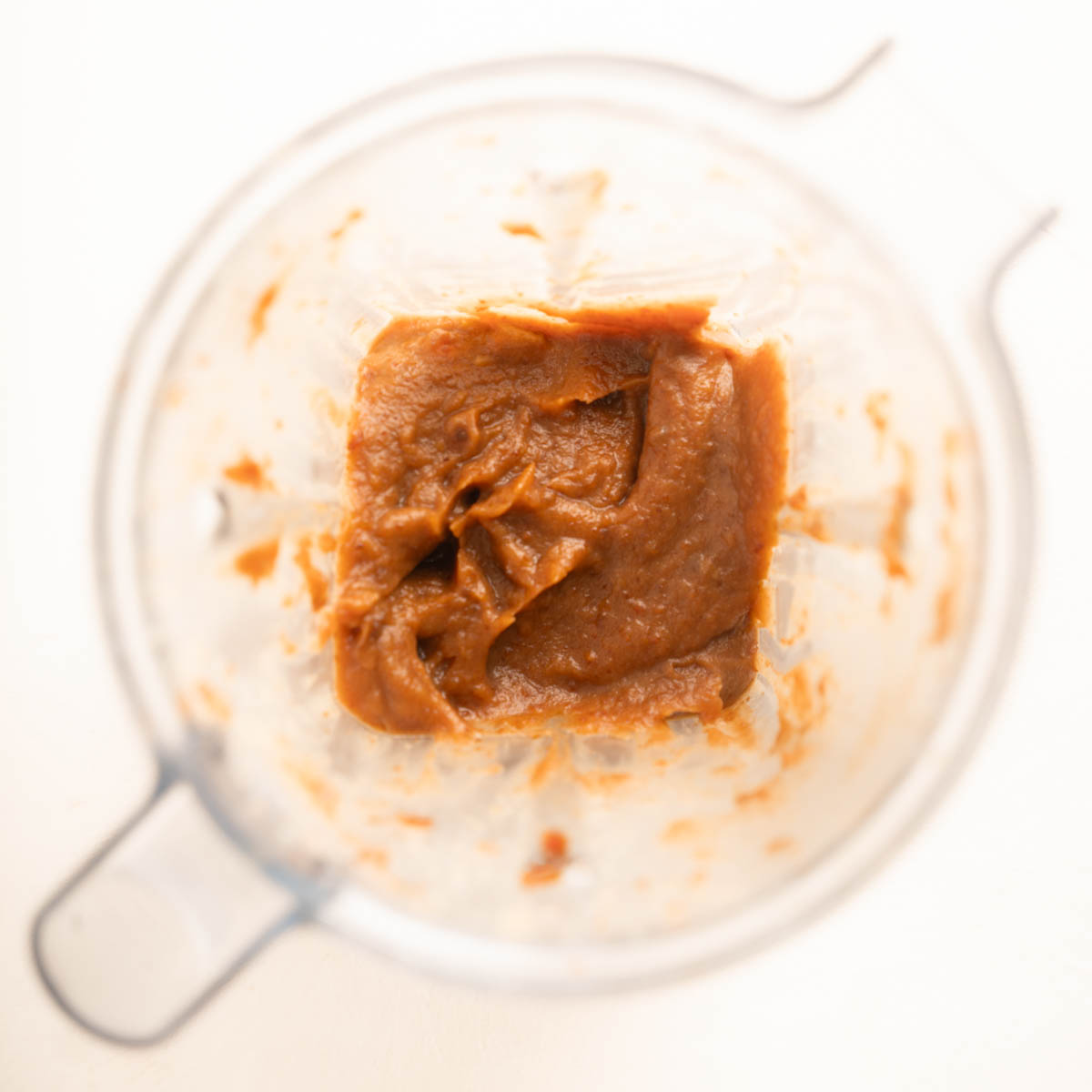 Top down of date caramel in a high powered blender