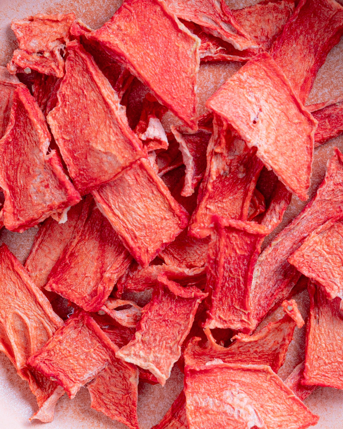 Close up of bright redish-pink dehydrated watermelon