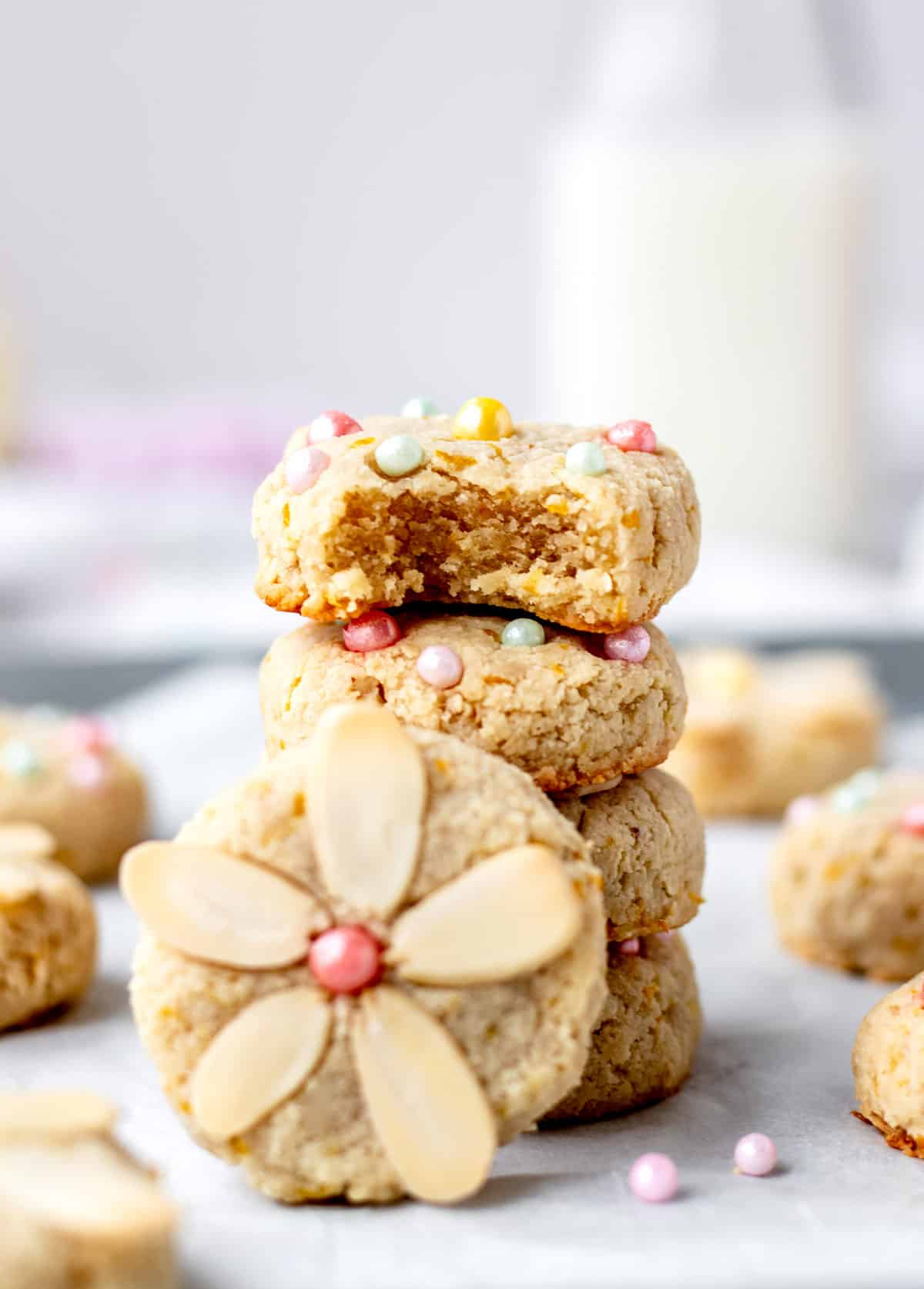 lemon almond flour cookies stacked with decorative sprinkles