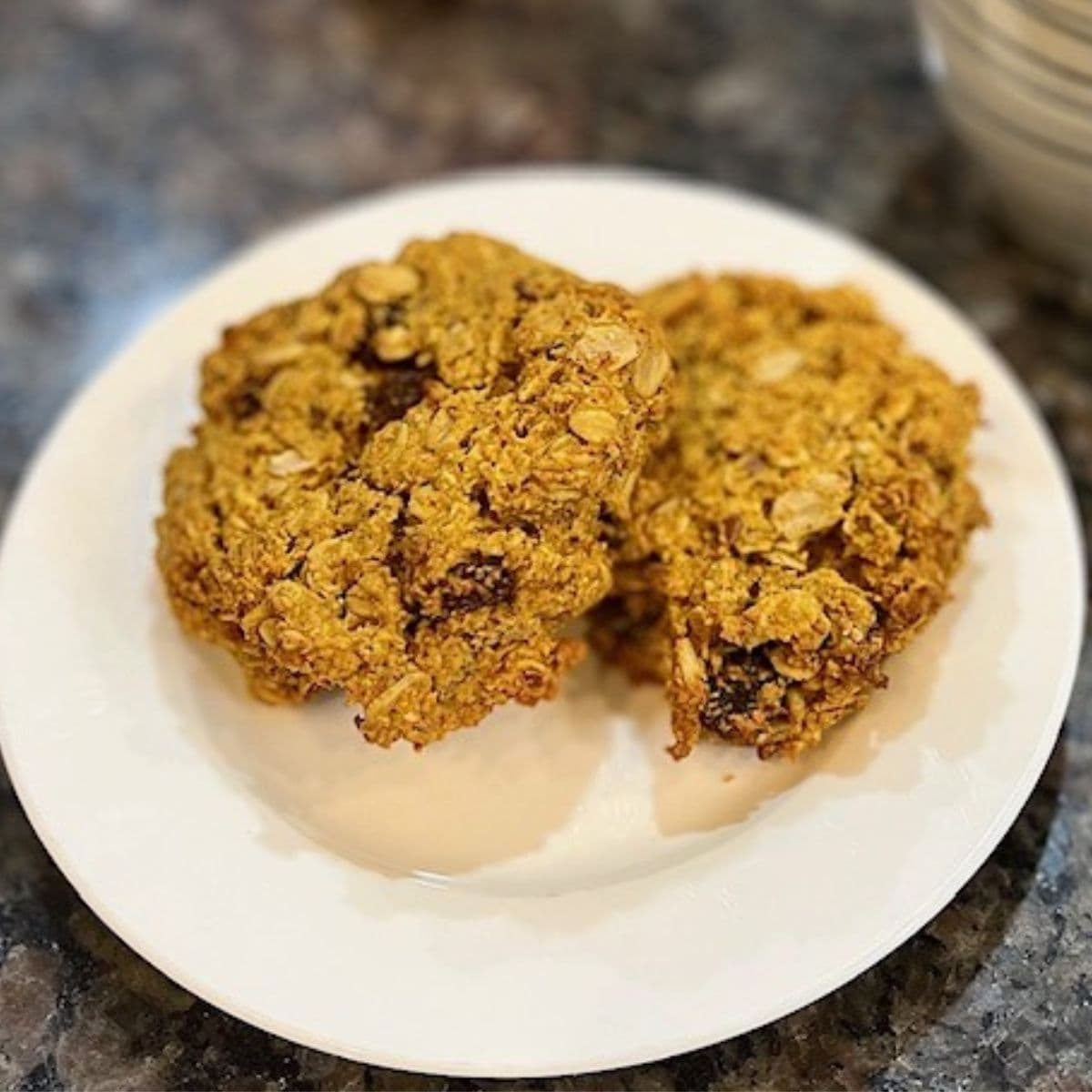 vegan pumpkin oatmeal raisin cookies on a plate