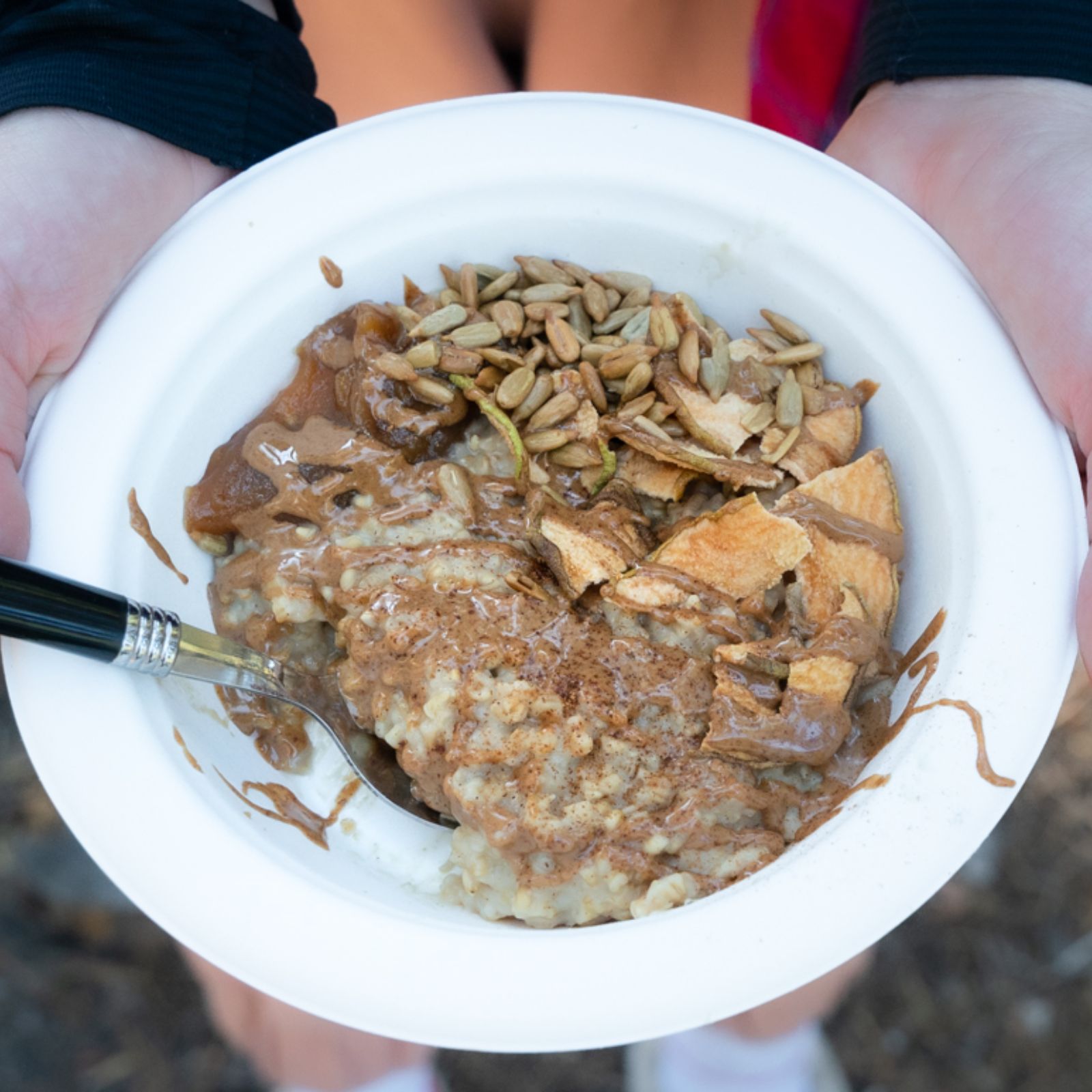 Camping Oatmeal with nut butter, dried apples, seeds, and creamy oatmeal. 