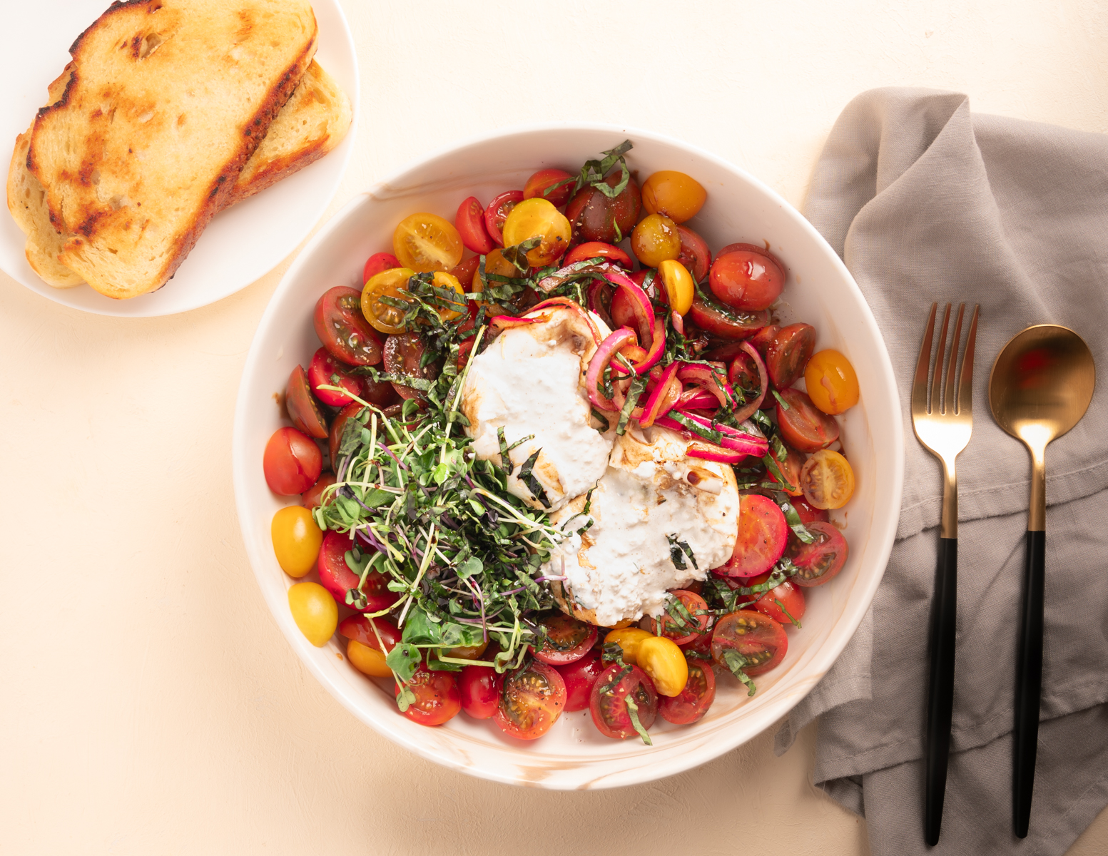 Burrata Capresse with Cherry Tomatoes and a side of toasted sourdough bread