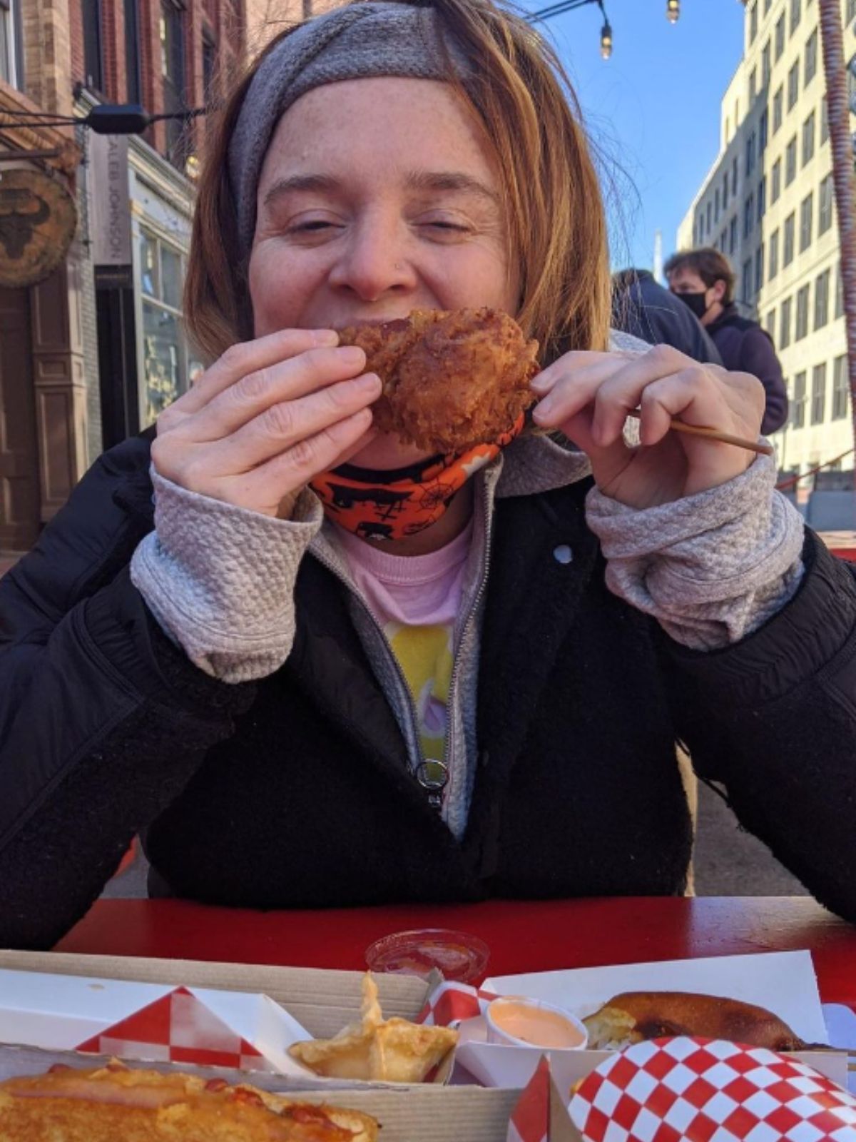 Sarah Harper Eating Food on a stick