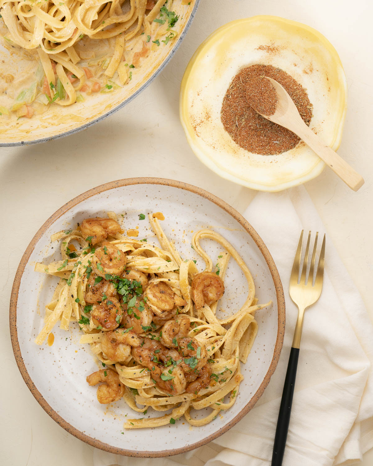 Fettuccine Alfredo with homemade cajun seasoning and shrimp plated