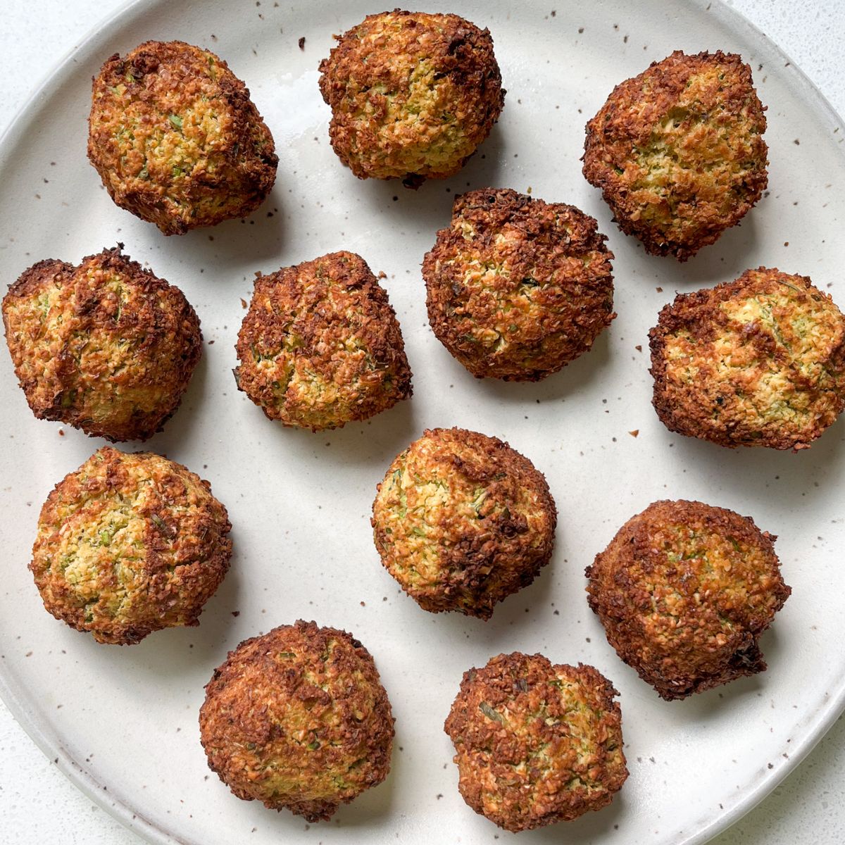 air fryer falafels on a plate - golden brown in color