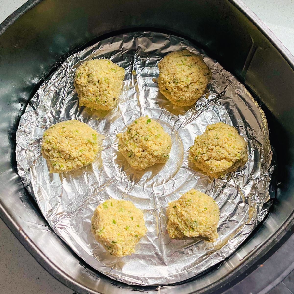 shaped falafel about to be cooked in the air fryer